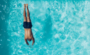 Oklahoma City has dozens of pools for residents to enjoy. Here, a man swims in an Oklahoma pool.