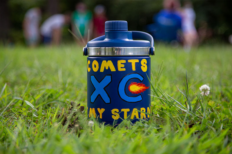 Water jug painted with Comets XC logo