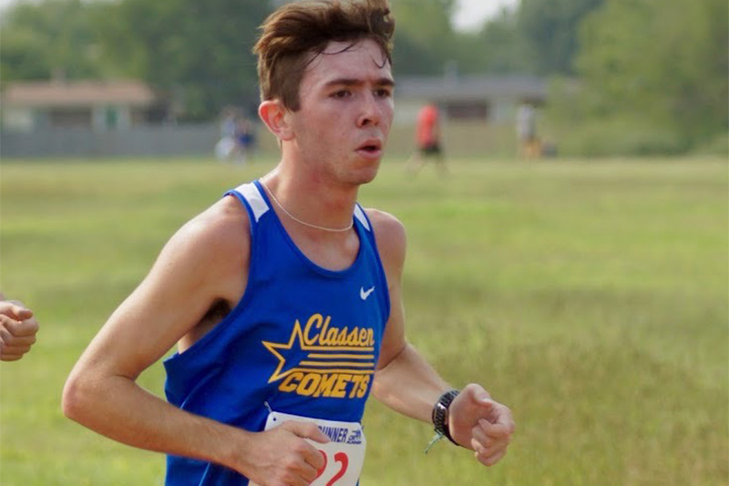 Classen SAS High School at Northeast cross country athlete Aiden Kirkpatrick running in a cross country meet