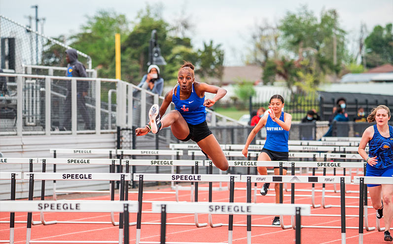 Fields & Futures All-City Track Meet blog image of female athlete from John Marshall competing in hurdles