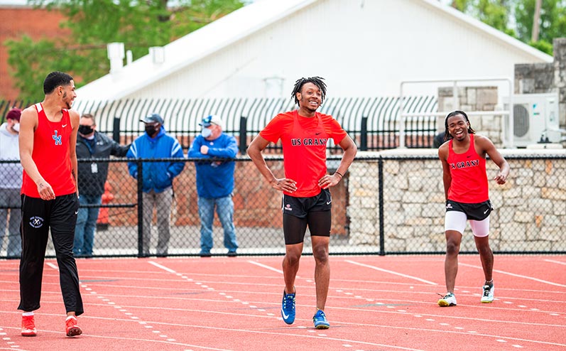 Fields & Futures All-City Track Meet Blog high school athletes from different schools laughing after a race