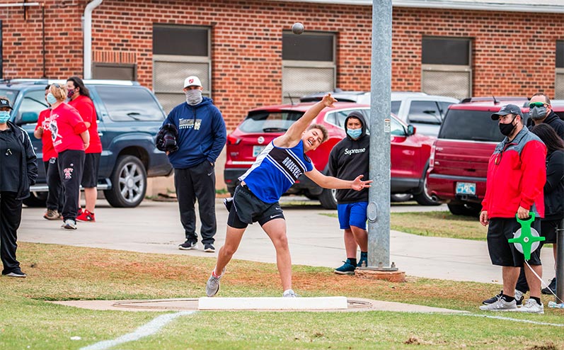 Fields & Futures All-City Track Meet Blog male middle school athlete throwing the shot put