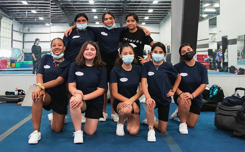 Fields & Futures blog 2021 OKCPS Cheer Clinic Wrap-Up story image of cheerleading team taking a team picture